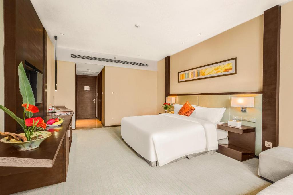 Postel nebo postele na pokoji v ubytování Lia Charlton Hotel Shenzhen