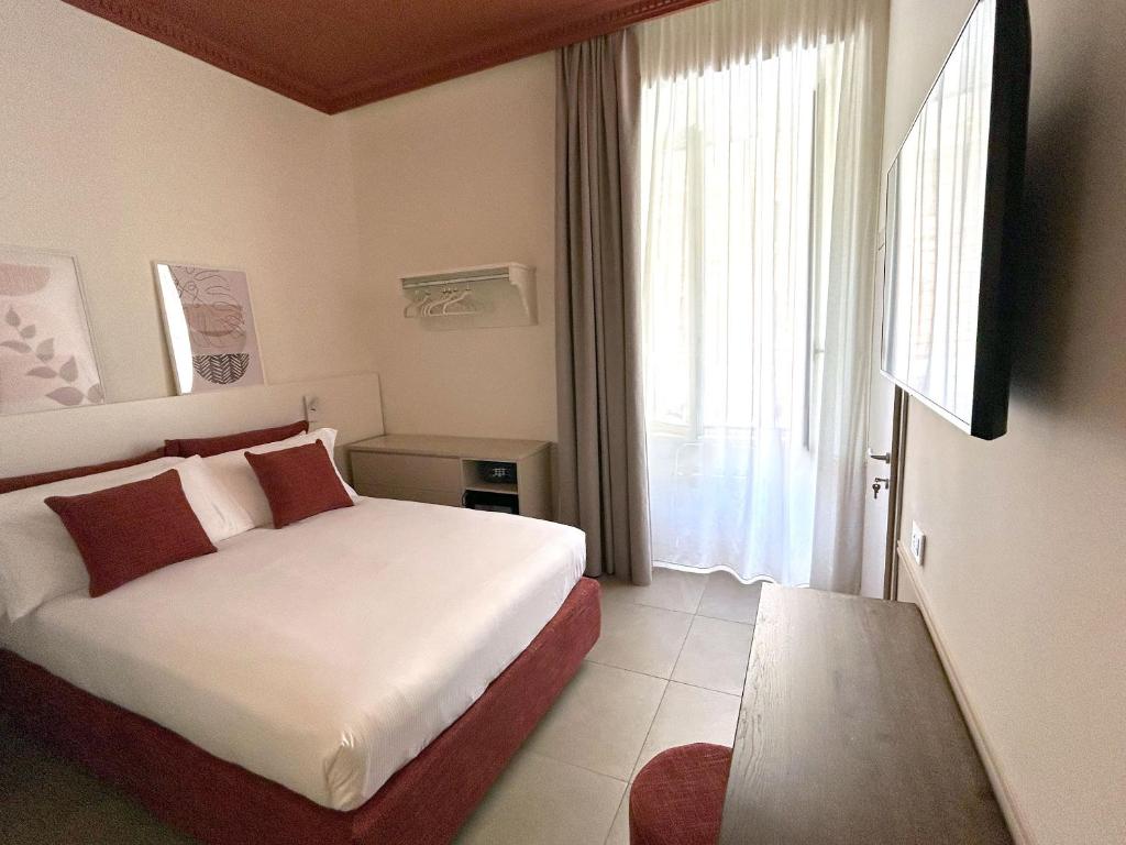 Postel nebo postele na pokoji v ubytování Astom Suites