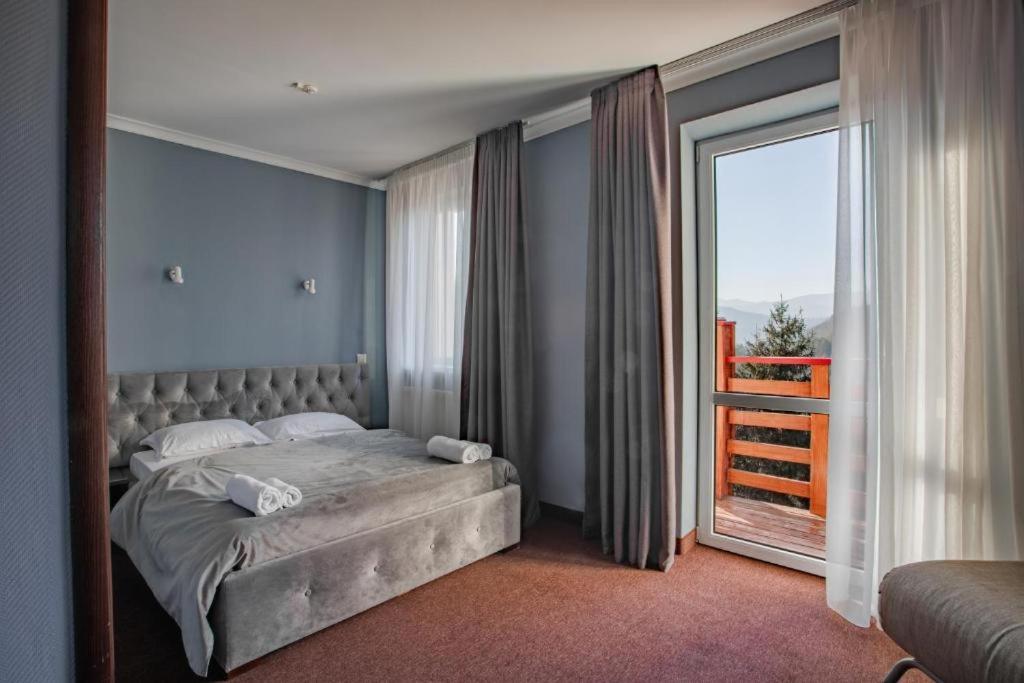 Postel nebo postele na pokoji v ubytování Wellland Hotel