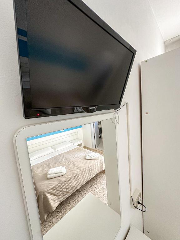 Postel nebo postele na pokoji v ubytování Hotel Serafini