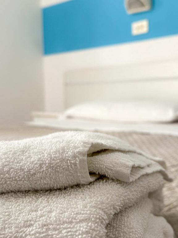 Postel nebo postele na pokoji v ubytování Hotel Serafini