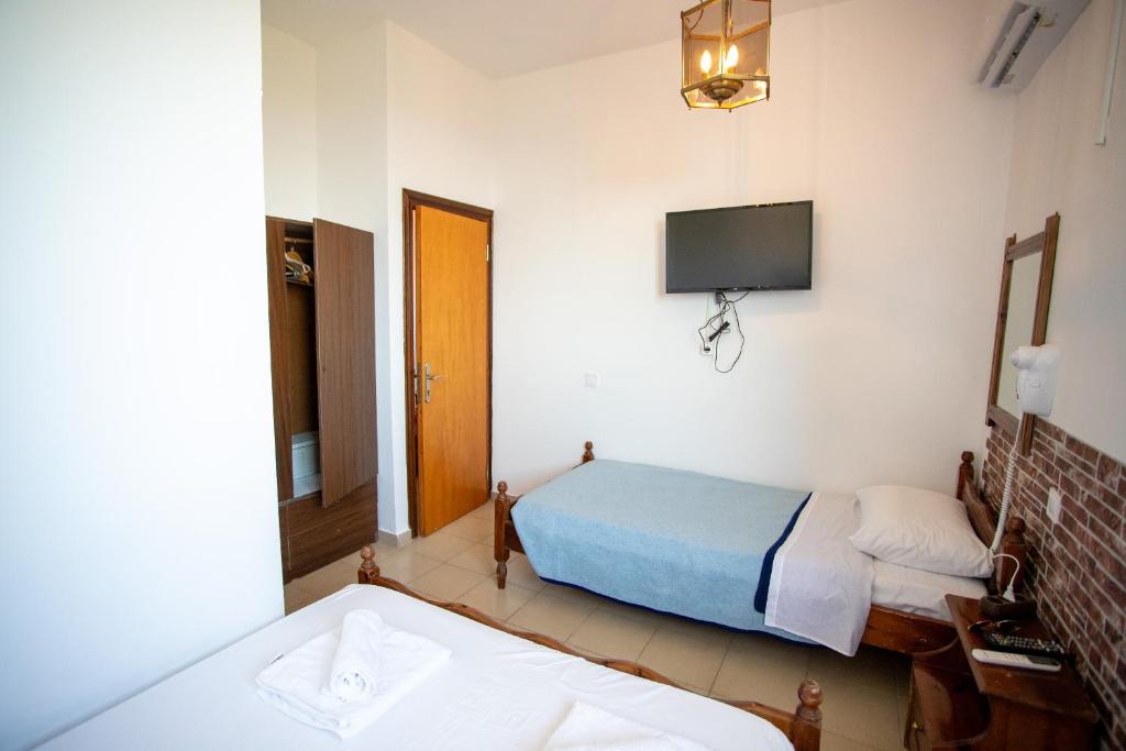 Postel nebo postele na pokoji v ubytování Star Sianna Village Rooms to let