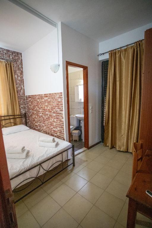 Postel nebo postele na pokoji v ubytování Star Sianna Village Rooms to let