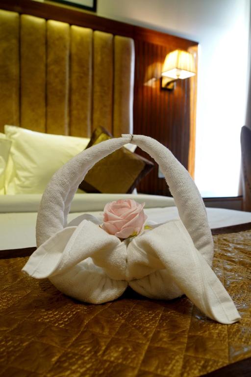 Postel nebo postele na pokoji v ubytování Hotel Sakura Gold