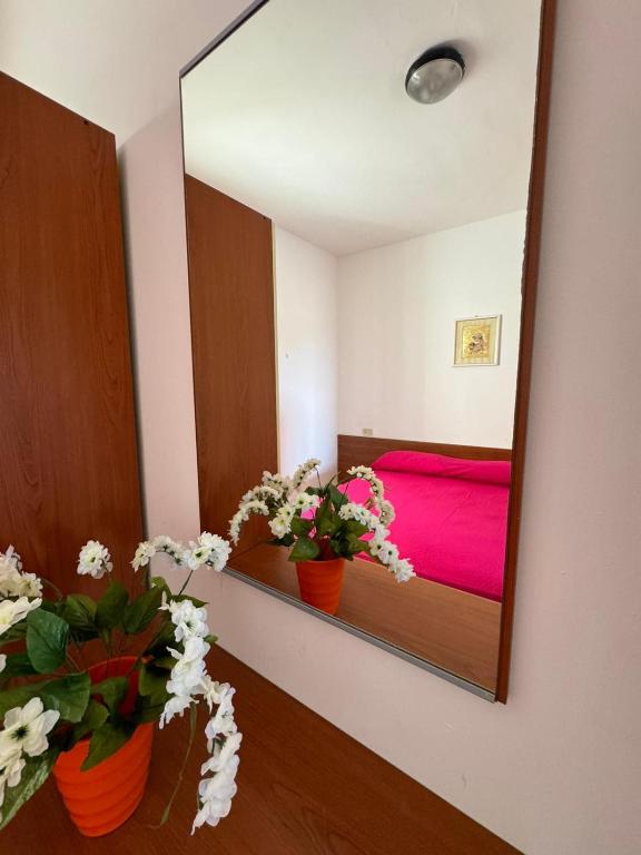 Postel nebo postele na pokoji v ubytování Dimora Flaminio