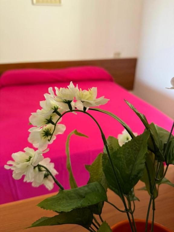 Postel nebo postele na pokoji v ubytování Dimora Flaminio