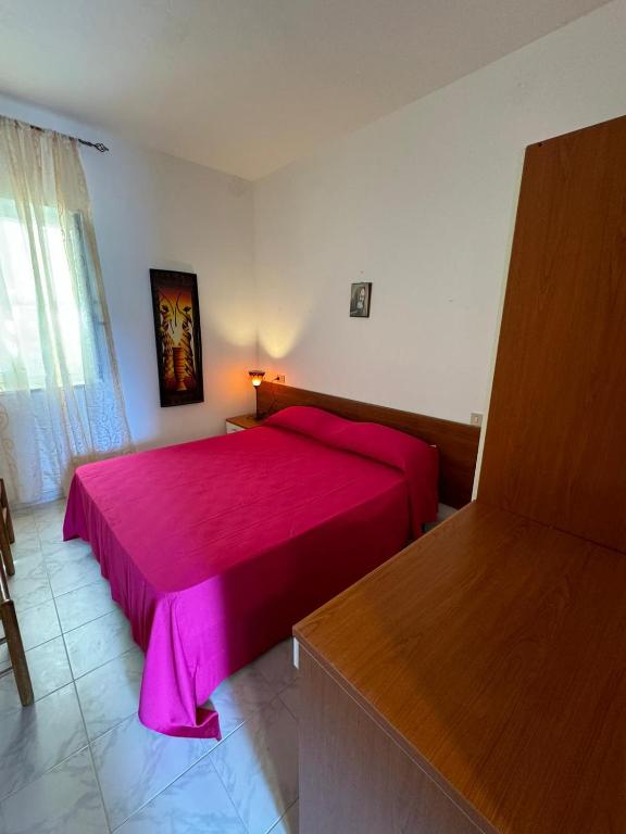Postel nebo postele na pokoji v ubytování Dimora Flaminio