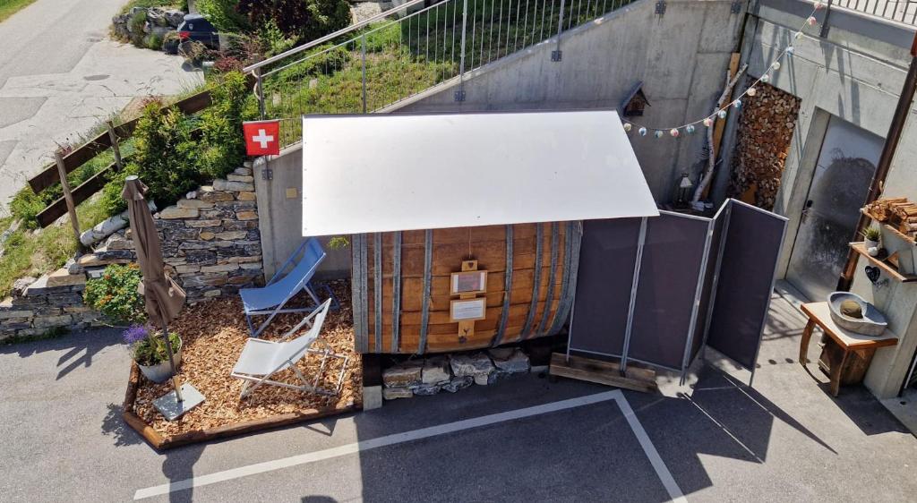 an overhead view of a building with a white sign at Chalet Diognysos B&B, Boutique Hotel & Wellness in Crans-Montana