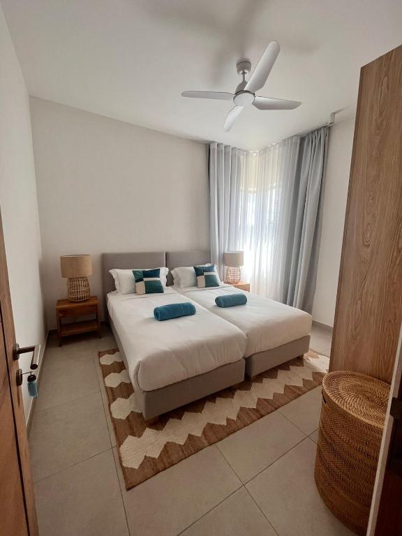 Postel nebo postele na pokoji v ubytování Beachfront Apartment Ocean Point