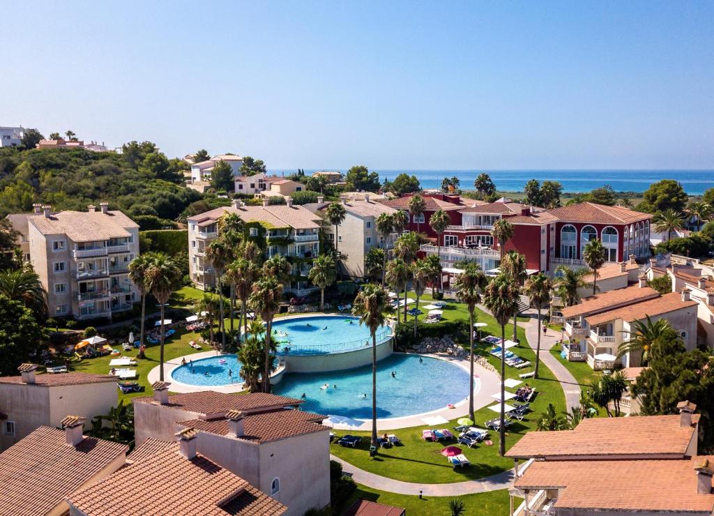 an aerial view of a resort with a swimming pool at HG Jardín de Menorca in Son Bou