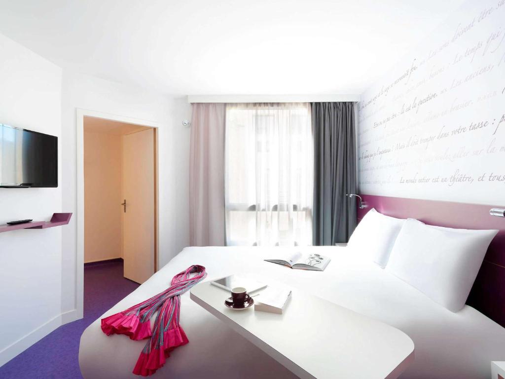Postel nebo postele na pokoji v ubytování ibis Styles Montpellier Centre Comedie