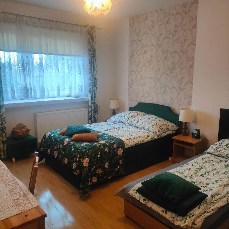 Postel nebo postele na pokoji v ubytování Agrogospodarstwo HALINA ŁUC