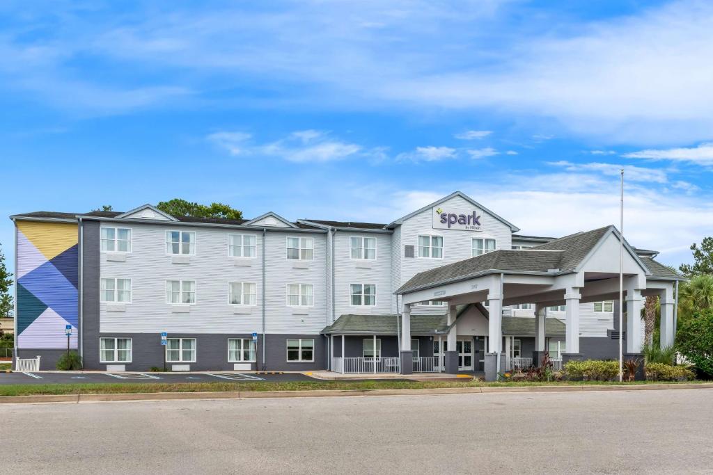 a large white hotel with a gazebo at Spark By Hilton St. Augustine I 95 in Saint Augustine