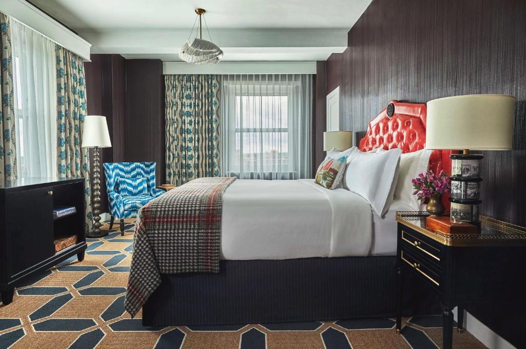 a hotel room with a large bed and a television at Graduate by Hilton Providence in Providence
