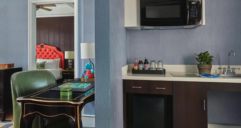 a small kitchen with a table and a microwave at Graduate by Hilton Providence in Providence