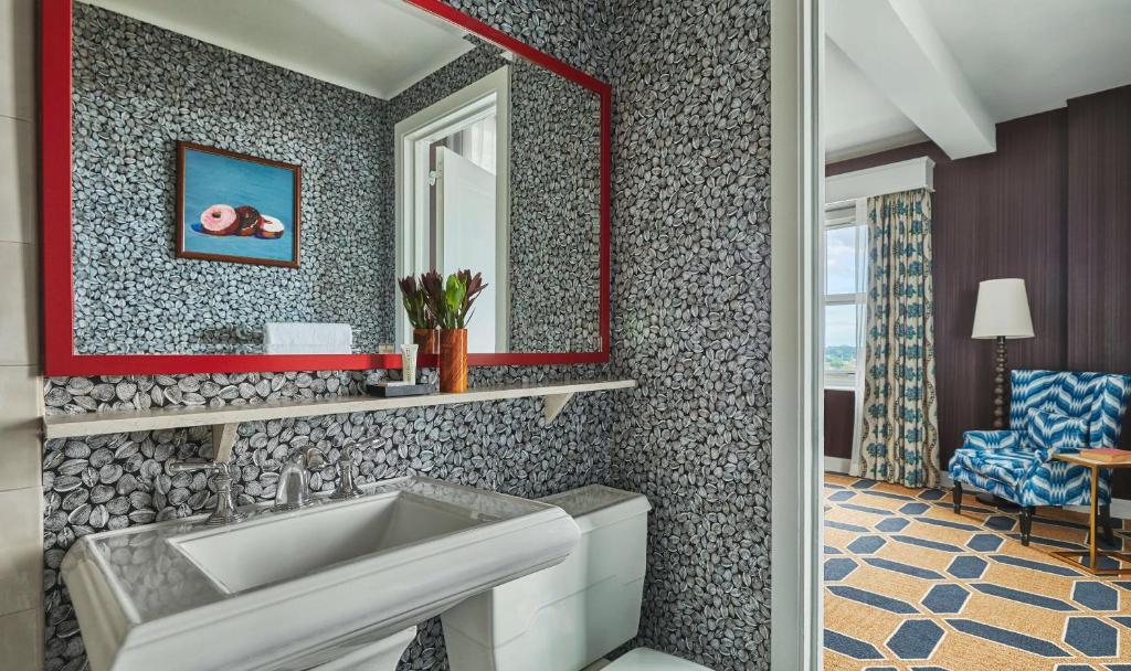 a bathroom with a sink and a mirror at Graduate by Hilton Providence in Providence