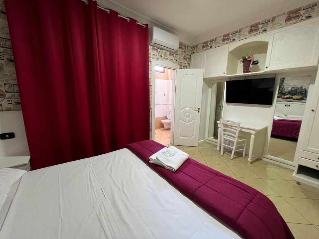 Postel nebo postele na pokoji v ubytování Hotel Tiffany