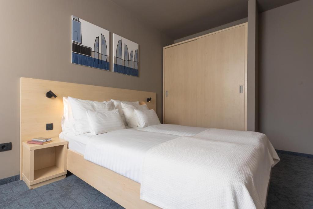 Postel nebo postele na pokoji v ubytování Family Hotel Adria - All inclusive
