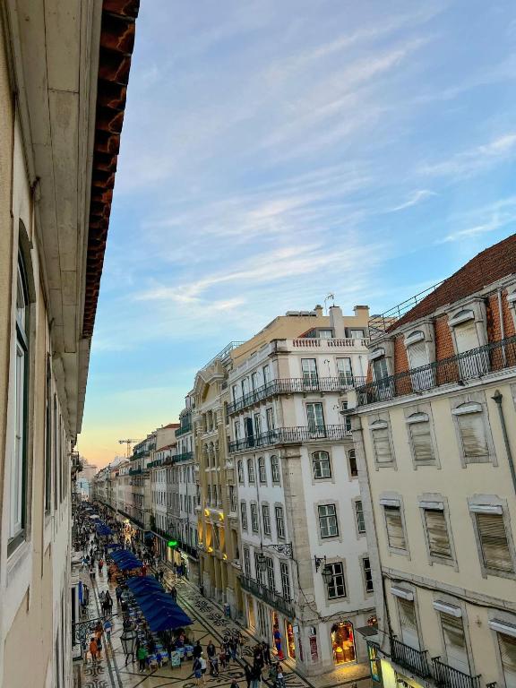 a view of a city street with buildings at Large apartment on Rua Augusta in Lisbon