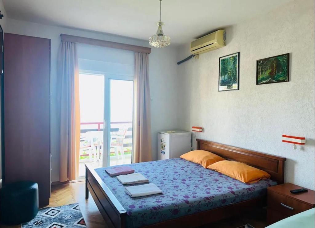 Postel nebo postele na pokoji v ubytování Hana & Uma Apartments