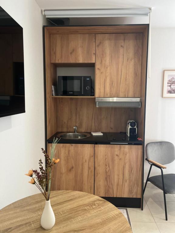Kuchyň nebo kuchyňský kout v ubytování AppartHôtel Elite Spa