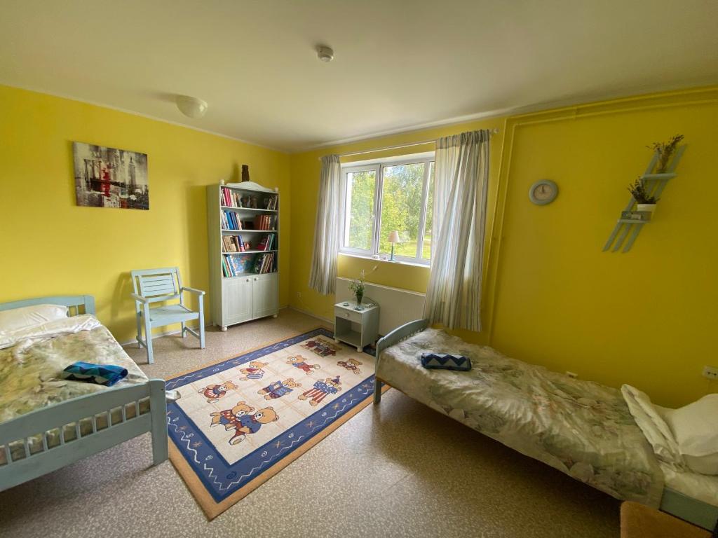 Postel nebo postele na pokoji v ubytování Torgu Royal Guesthouse