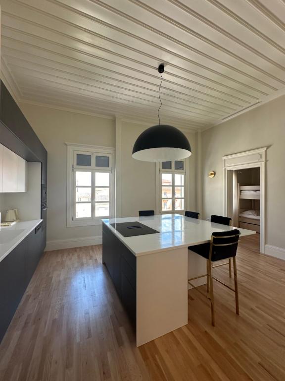 a kitchen with a large island in a room at Castellano Hotel & Suites in Nafplio