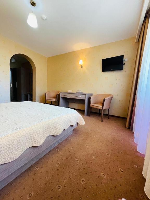 Postel nebo postele na pokoji v ubytování Ideal Predeal