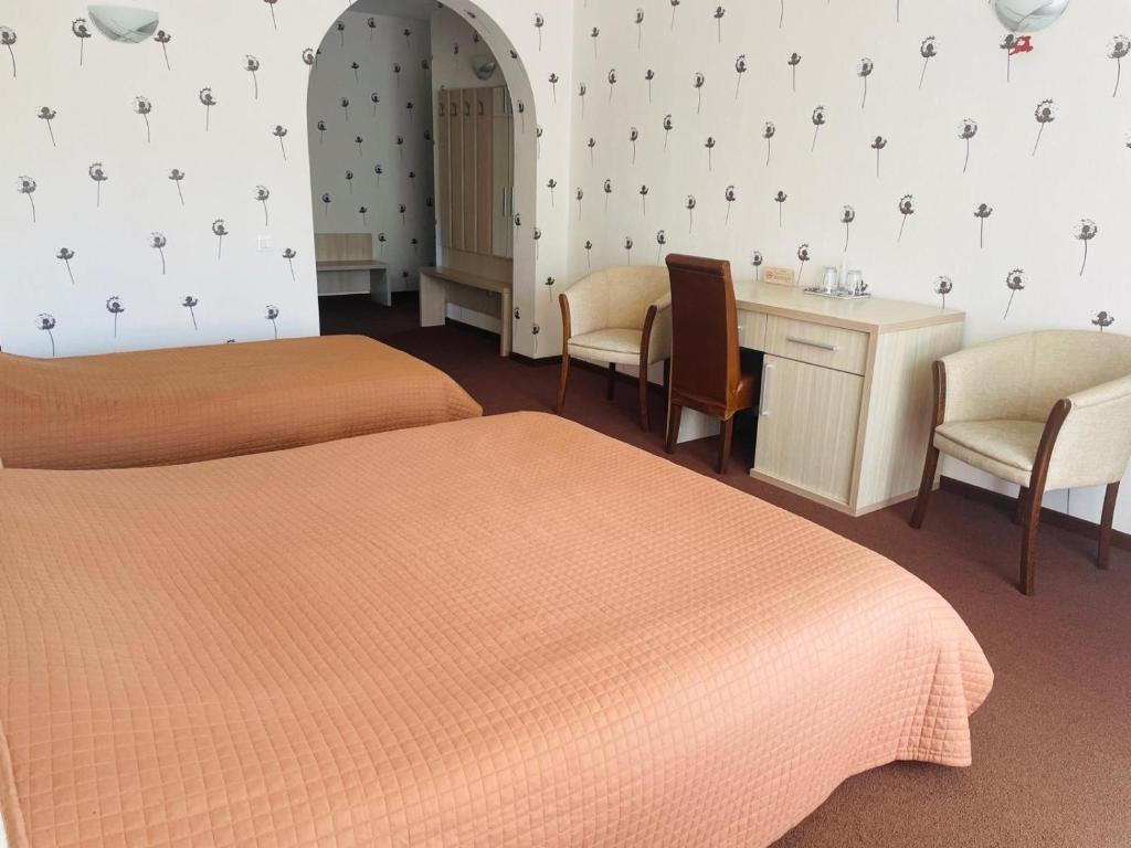 Postel nebo postele na pokoji v ubytování Ideal Predeal