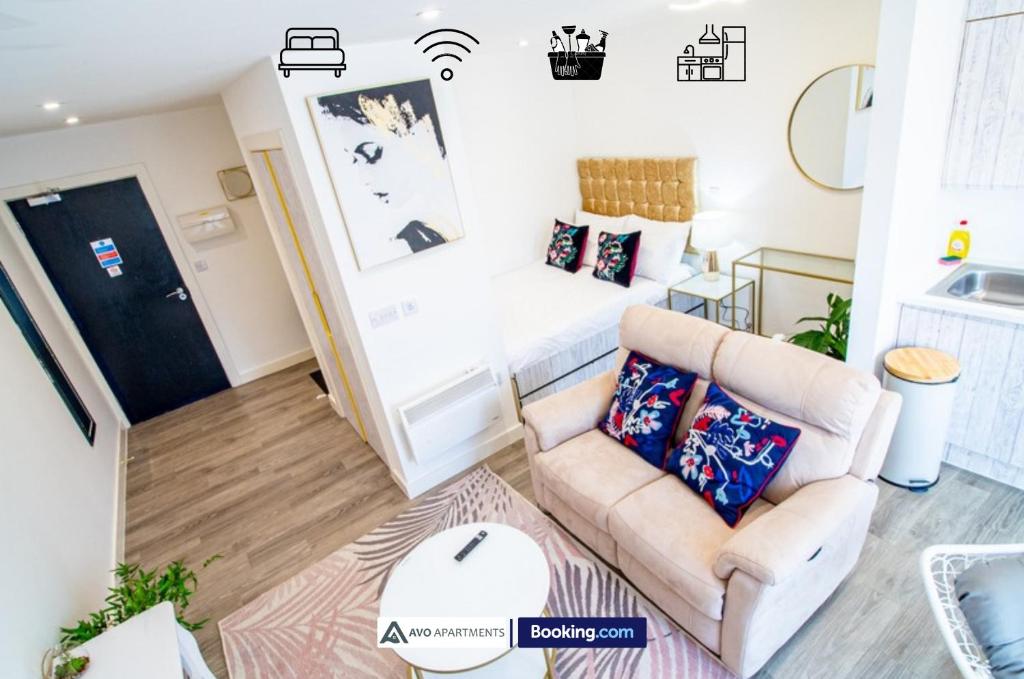 a living room with a couch and a bed at City Center Studio Apartments By AVO Apartments Sheffield in Sheffield
