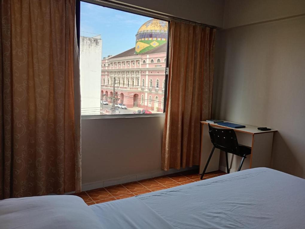 Postel nebo postele na pokoji v ubytování Gran hotel teatro