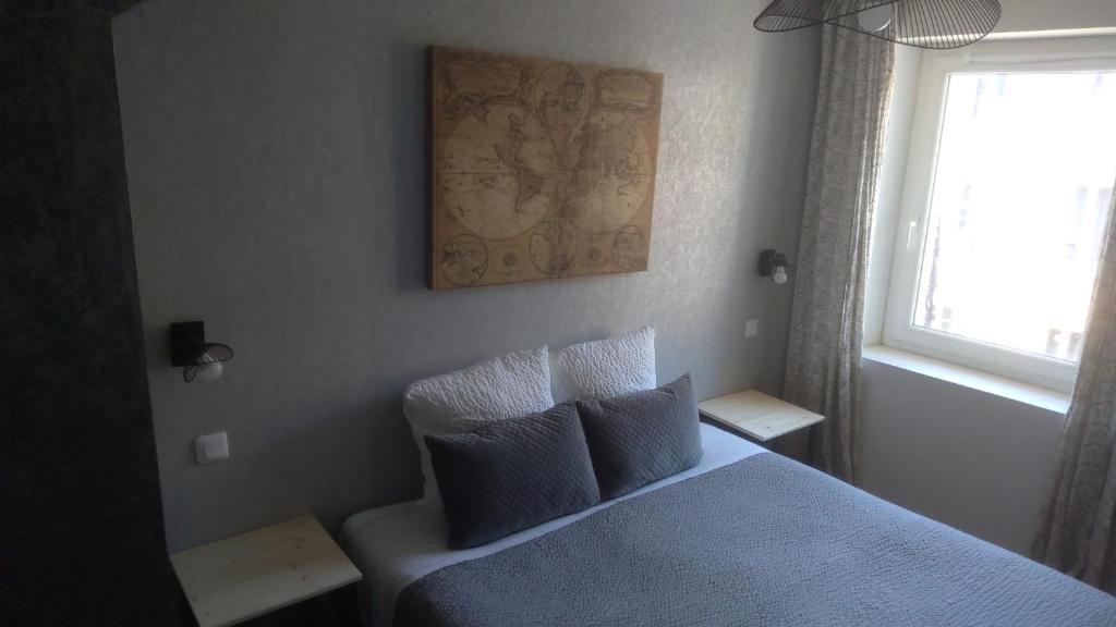 Postel nebo postele na pokoji v ubytování Logis Hôtel La Clé Des Songes