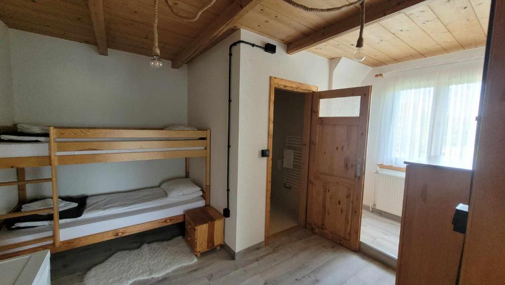 Postel nebo postele na pokoji v ubytování U Juhasa Miętówka