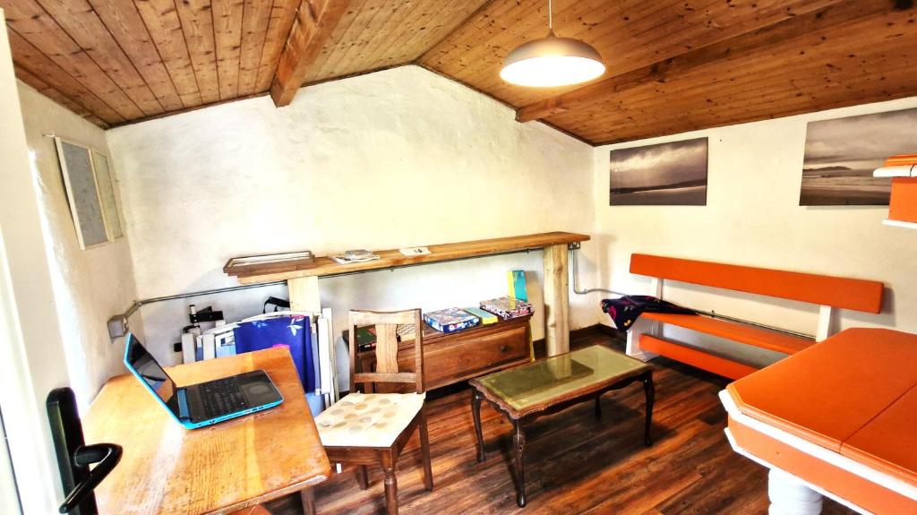 A seating area at The Rockhouse - Cosy stone built Thatch Cottage