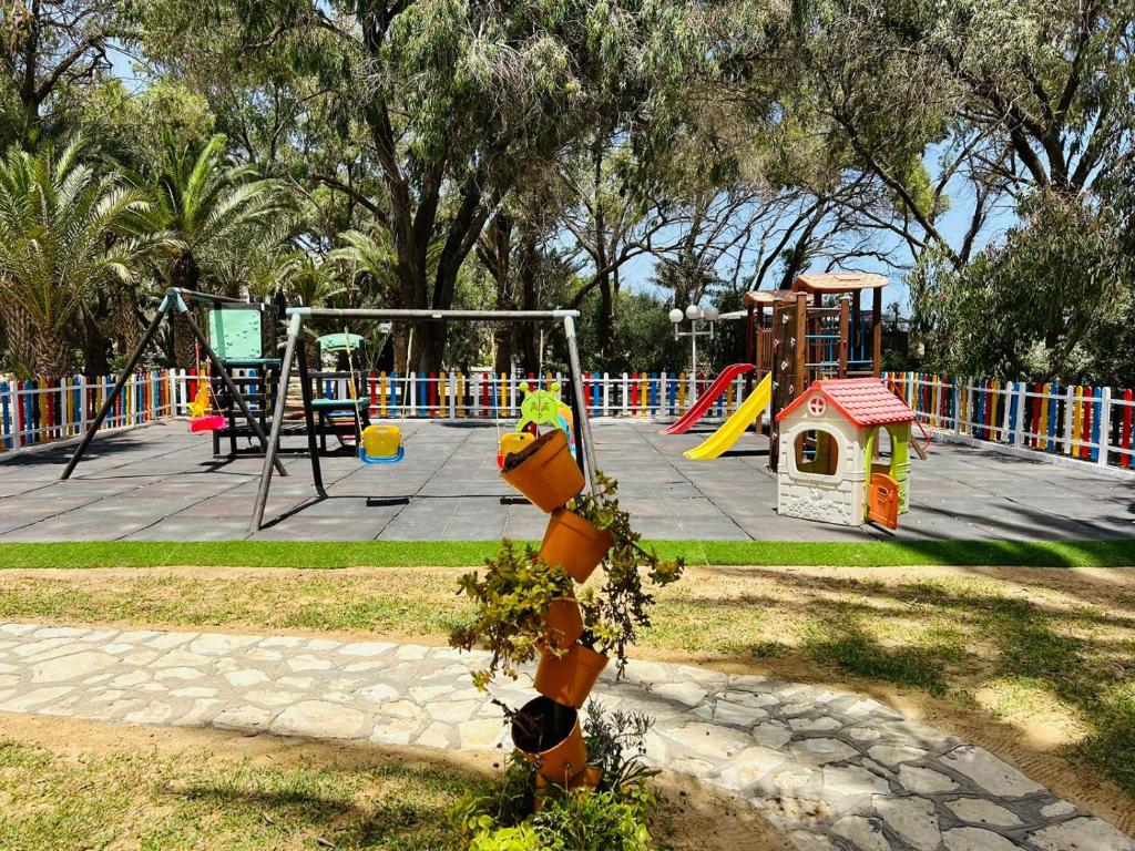 a park with a playground with a play area at Marhaba Royal Salem - Family Only in Sousse