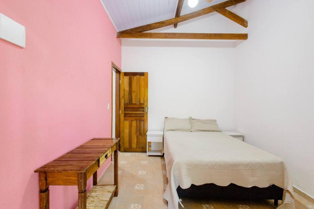 En eller flere senge i et værelse på Suites da Ana