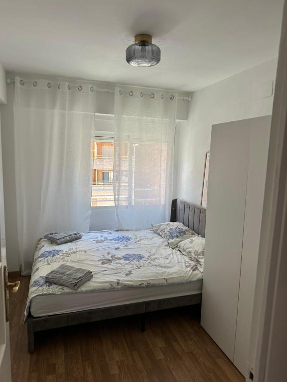 Postel nebo postele na pokoji v ubytování Seashell apartment in Cullera