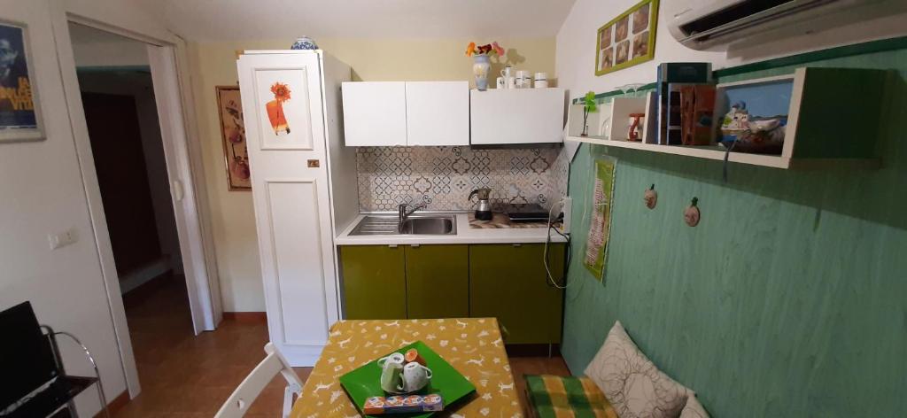 Kuchyň nebo kuchyňský kout v ubytování Le Coin Vert