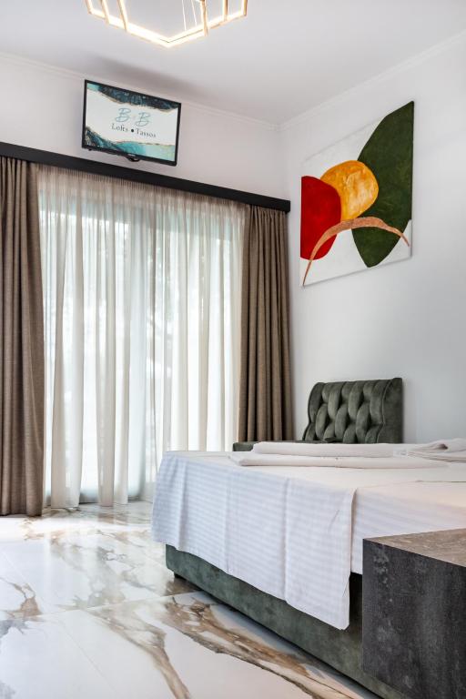 Postel nebo postele na pokoji v ubytování B&B Lofts Thassos