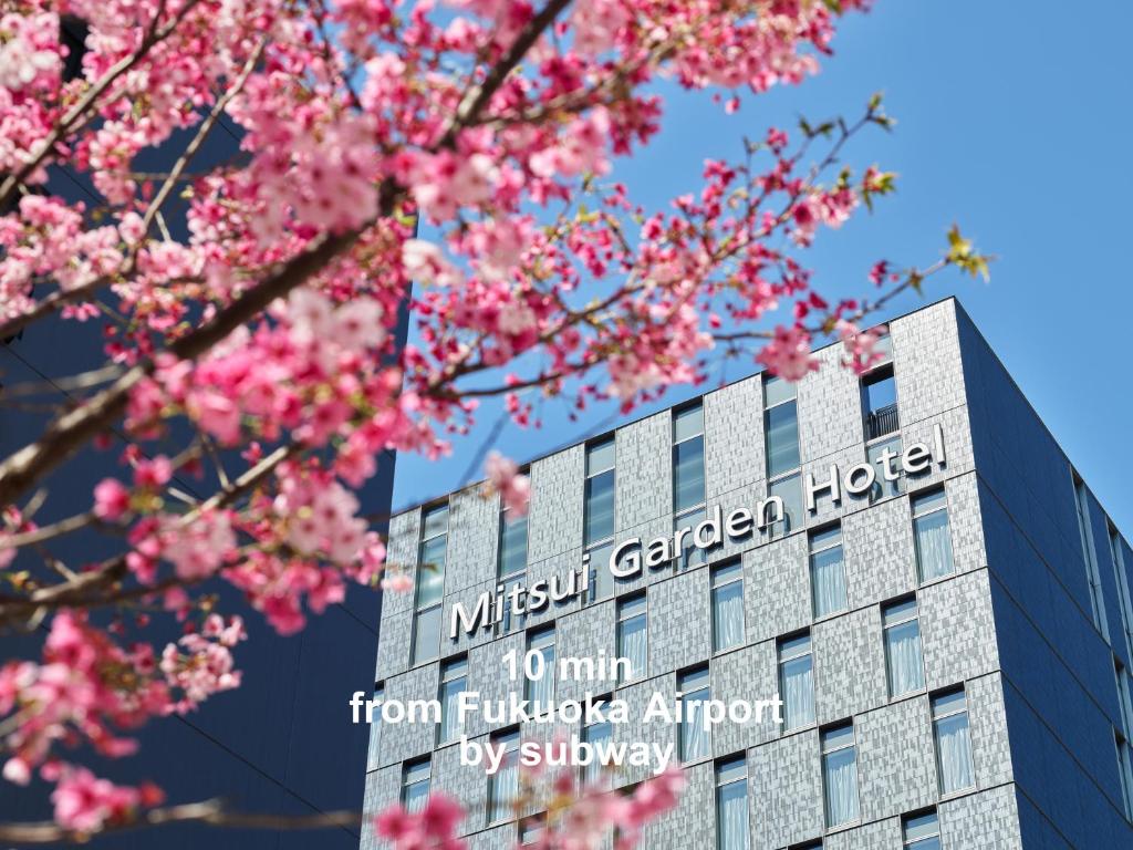 a building with the sign for the museum garden hotel at Mitsui Garden Hotel Fukuoka Nakasu in Fukuoka