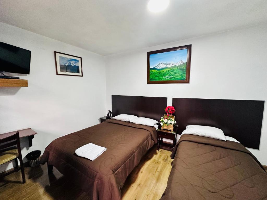 Postel nebo postele na pokoji v ubytování Hotel Montecarlo