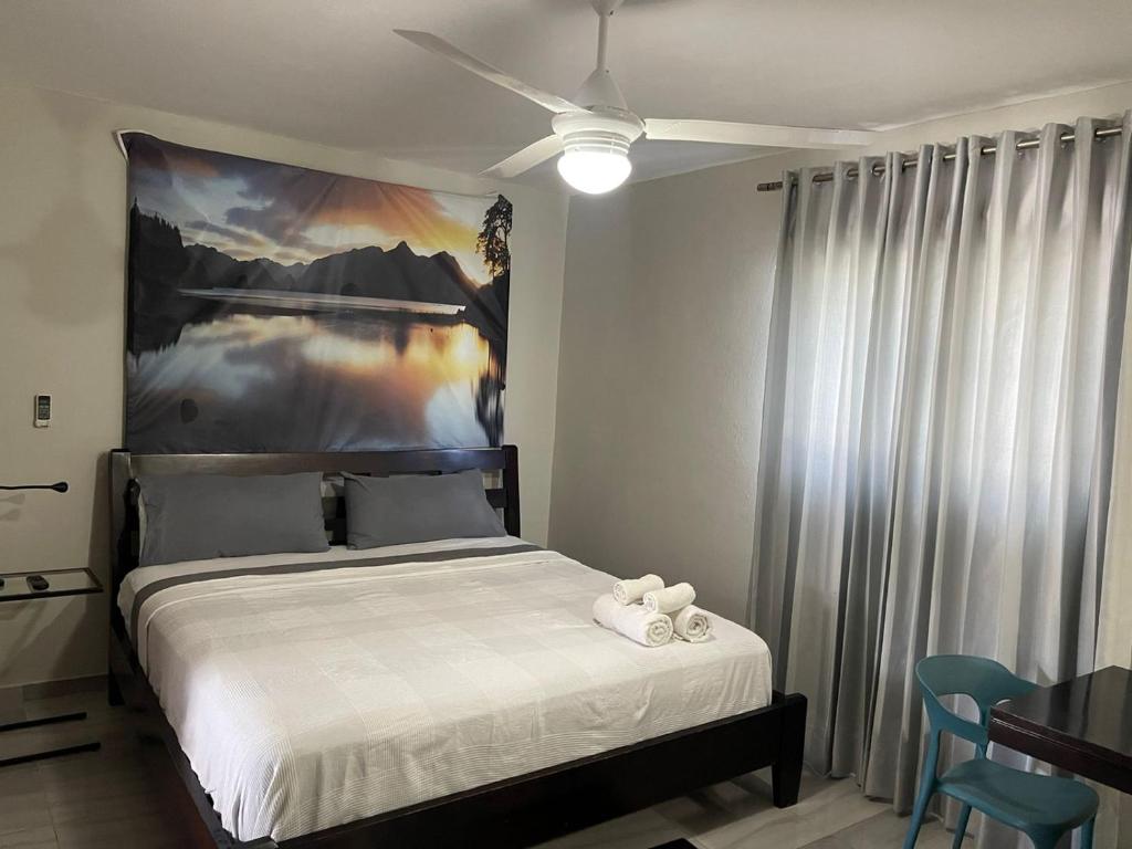 Postel nebo postele na pokoji v ubytování Hotel Casa Jum