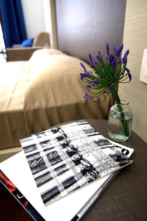 Postel nebo postele na pokoji v ubytování Giuliani Rooms