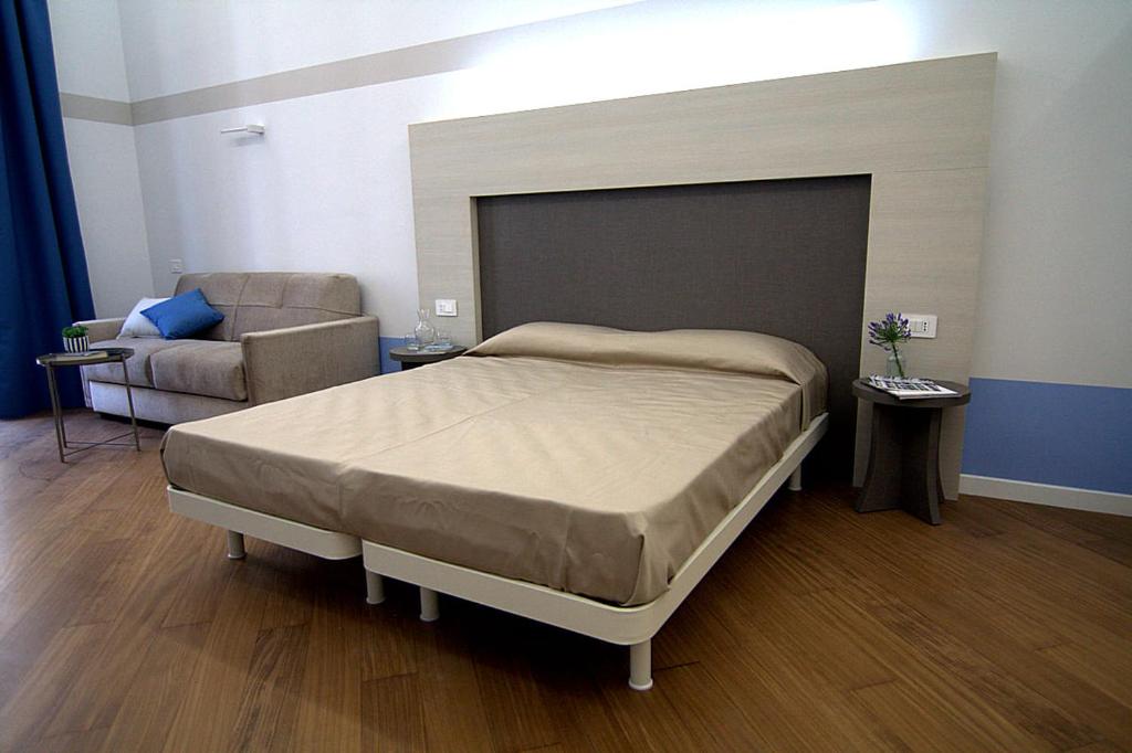 Postel nebo postele na pokoji v ubytování Giuliani Rooms