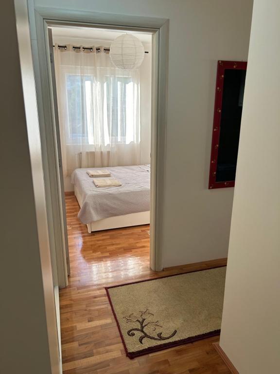 Postel nebo postele na pokoji v ubytování Slatki Snovi - Novi apartman u centru Vranja - FREE PARKING