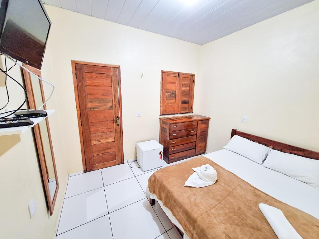 Postel nebo postele na pokoji v ubytování Babylon Village