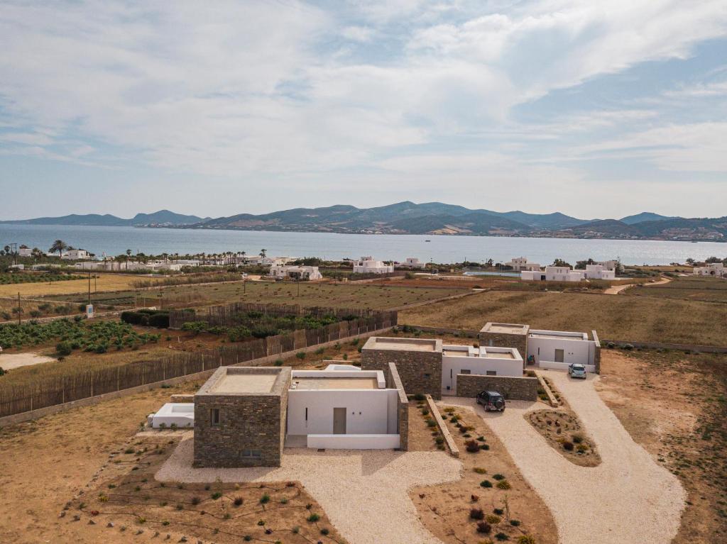 an aerial view of a farm with a body of water at Campo Suites and Apartments in Kampos Paros