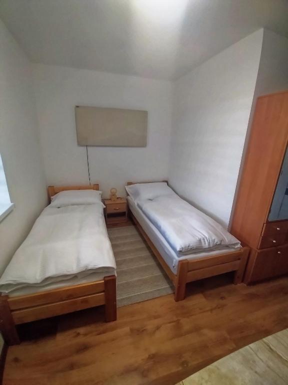 Posteľ alebo postele v izbe v ubytovaní Ubytovanie s kuchynkou