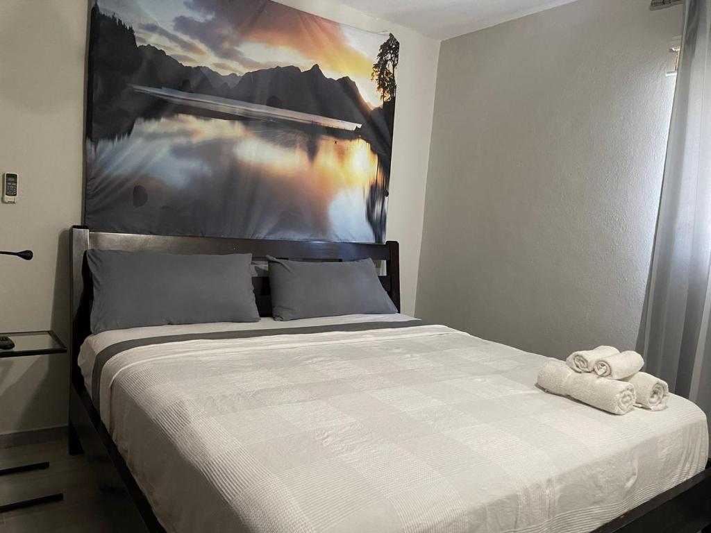 Postel nebo postele na pokoji v ubytování Hotel Casa Jum