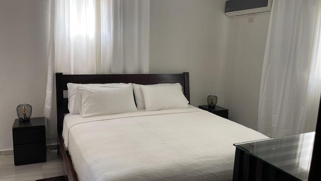 Postel nebo postele na pokoji v ubytování Hotel Casa Jum